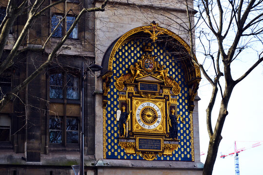 Paris, France - Mars 10th 2017 : focus on the astronomical clock fixed on the wall of the courthouse of Paris.