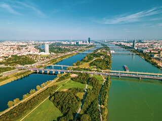 Fototapeta premium Aerial drone view of Danube river in Vienna Austria cityscape with danube island