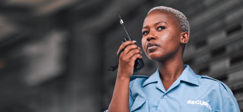 Security, radio and a black woman police officer in the city during her patrol for safety or law enforcement. Walkie talkie, communication and service with a female guard on a street in an urban town