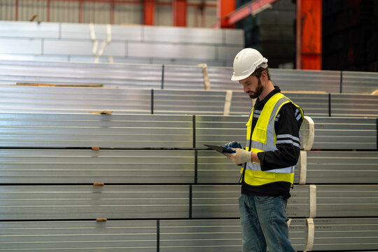Man Worker hands holding tablet on warehouse logistic network distribution and smart transportation Logistic import export and industry.
