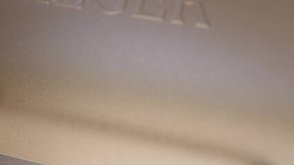 This close up video shows a grill lid being closed on a smoked brisket feast.