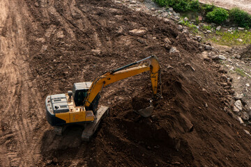 Excavators excavate earth at the construction site