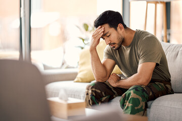 Man with headache, stress and mental health problem, therapy and psychology, depressed and sitting on couch. Male person in crisis, migraine and medical issue, sad with depression and pain at home