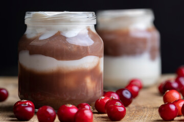 Yogurt with plum jam in a jar