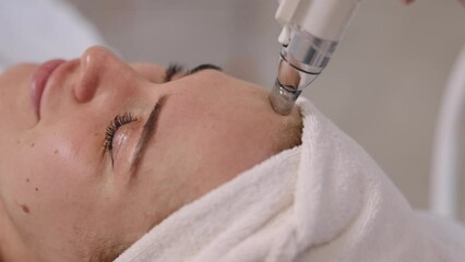 Skincare specialist, Facial care, Beauty treatment. At beauty salon, skilled cosmetologist offers range of treatments such as vacuum lifting massage, vacuum lymphatic drainage massage, facial massage