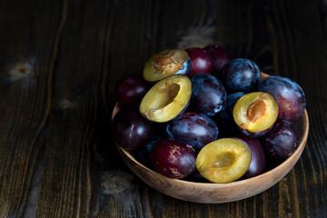 Ripe plums on the table in the kitchen