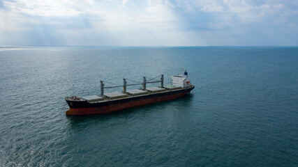 Self-unloading bulk carrier at Rio De La Plata anchorage. Aerial side view.