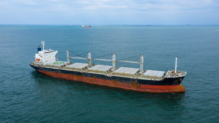 Naklejka na ściany i meble Self-unloading bulk carrier at Rio De La Plata anchorage. Aerial side view.