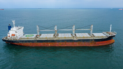 Self-unloading bulk carrier at Rio De La Plata anchorage. Aerial side view.
