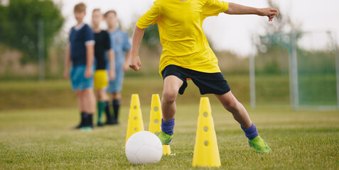 Young Athletes Show Their Skills in Dynamic Soccer Training Session. Boys on Football Practice...