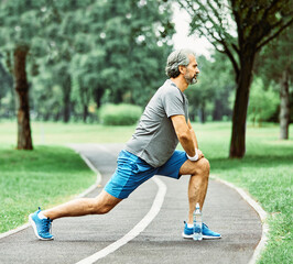 outdoor senior fitness man stretching active sport exercise runner healthy fit run lifestyle male retirement happy park summer nature jogging