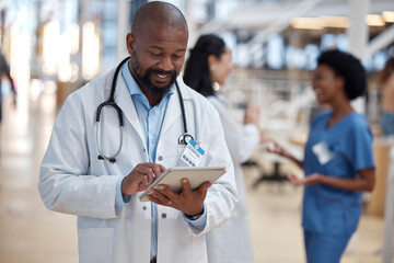 Doctor, black man and tablet for medical planning, data research or healthcare app in busy...
