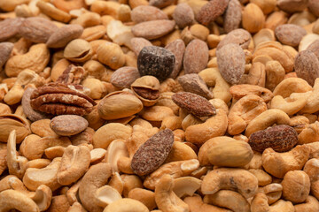 A group of almonds, pistachios, walnuts, macadamia, cashews.