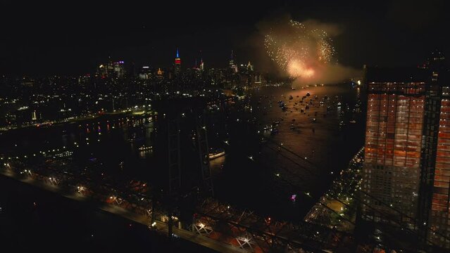flying over Williamsburg Bridge towards NYC July 4 fireworks