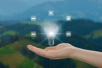 energy saving and environmental conservation icon concept in hand-held bulbs for environmental, social and governance in sustainable business and reducing global warming.