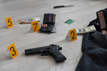 Flat lay composition with evidences and crime scene markers on wooden background