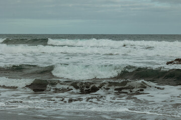waves breaking on the beach