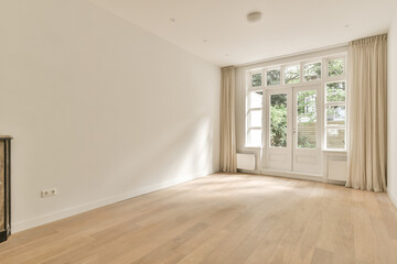 an empty living room with wood flooring and large windows in the room is very clean, but it's all...