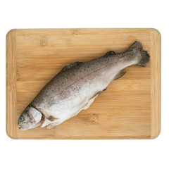 raw cleaned trout on a board