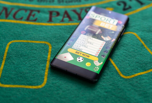 Smartphone with gambling mobile application. Sport and betting concept