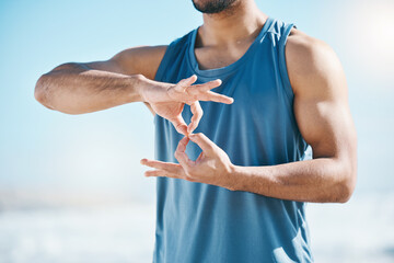 Hands, exercise and sign language with a sports man outdoor on a blurred background for a cardio...