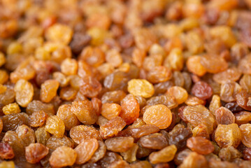 Close up background of raisins. Tasty sweet raisins made of high-quality grape