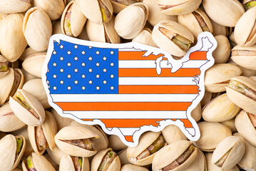 Paper flag and map of USA on pistachio. Growing pistachios in USA, origin of of nuts