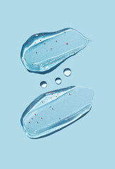 Cosmetic brush from gel on a blue background. Creamy texture. Skin care.