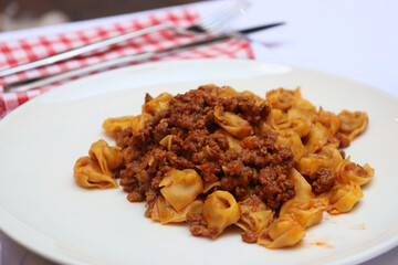 Tortellini al ragù, typical dish of Bologna also called tortellini bolognese