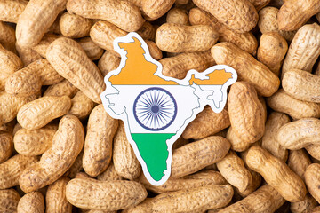 Flag and map of India on peanut. Growing peanut in India, origin of nuts