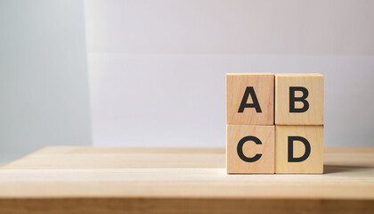 ABCD word written on wood cubes with white background