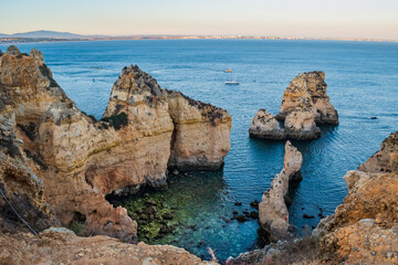 Fototapeta na wymiar Rock formations in aerial view and clear blue sea at Ponta da Piedade, Lagos - Algarve PORTUGAL
