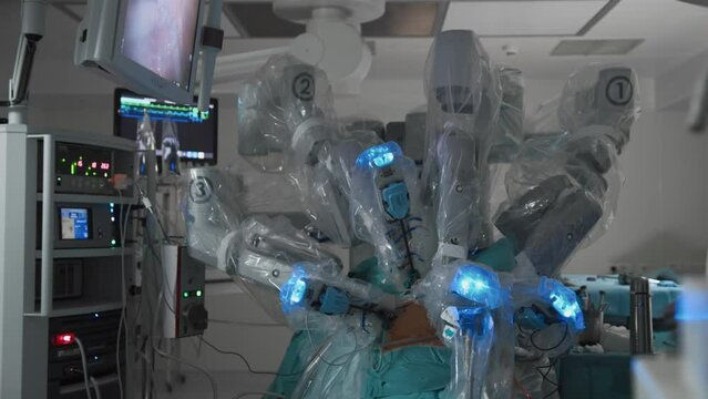 Surgical robotic arm system in fully equipped operating room in modern clinic, advanced medical technology and innovation
