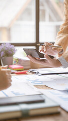 Financial analyst analysis business financial report on digital tablet during discussion at meeting of corporate showing the results of their successful teamwork, business meeting concept, Marketing