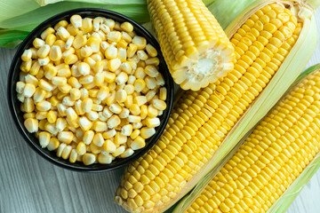 Flat lay image of fresh corn with seeds, Corn on the cob day concept image