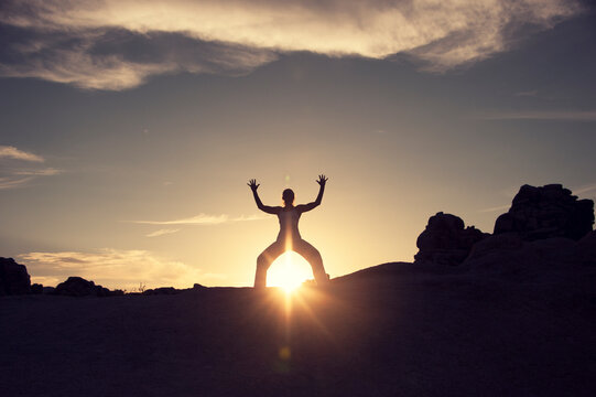 Human Being shamanic embodiment photograph of a woman in the boulders at sunrise. 