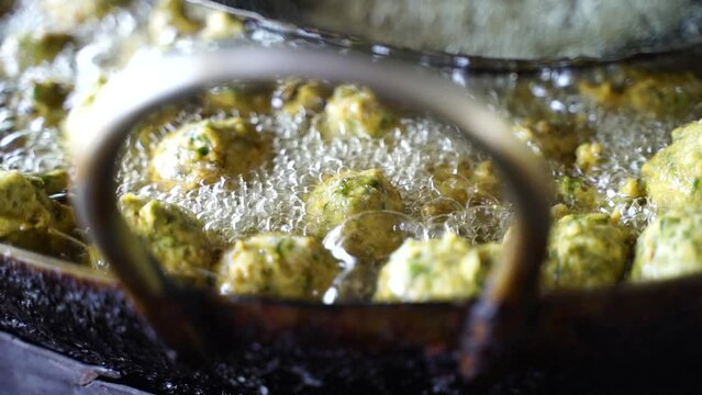 This is a closeup shot of one of the most famous Indian street food Frying Fritters