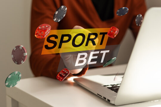 Man watching football play online broadcast on his laptop, cheering for his favourite team, making bets at bookmaker's website.