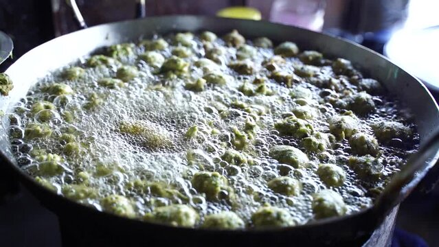 This is a closeup shot of one of the most famous Indian street food Frying Fritters