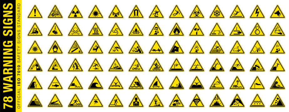 Full set of 78 isolated hazardous symbols on yellow round triangle board warning sign. Official ISO 7010 safety signs standard.