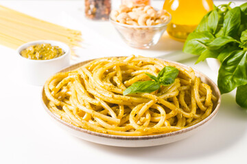 Spaghetti pasta with pesto sauce, basil, cashew and parmesan. Ingredients. 