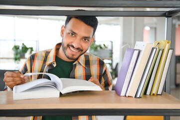 Happy indian male student at the library © Serhii