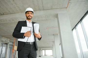 Portrait of a Indian engineer posing at the camera