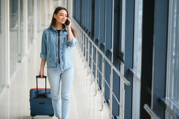 pretty woman waiting for her flight at airport