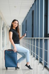 Pretty young female passenger at the airport