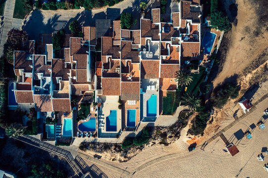 Aerial drone top down view of luxurious residences in Vale do Lobo, iconic beachfront resort and home, near Quarteira in Algarve, Portugal