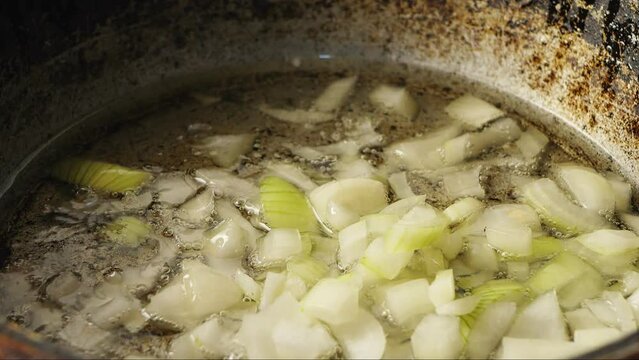 Finely chopped onion fried in a frying pan with boiling oil.