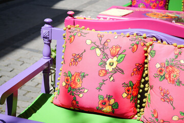 pink color texture pillow on a old sofa on cafe in istanbul 