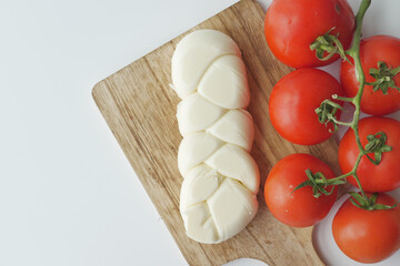 cheese and tomatoes on white background 