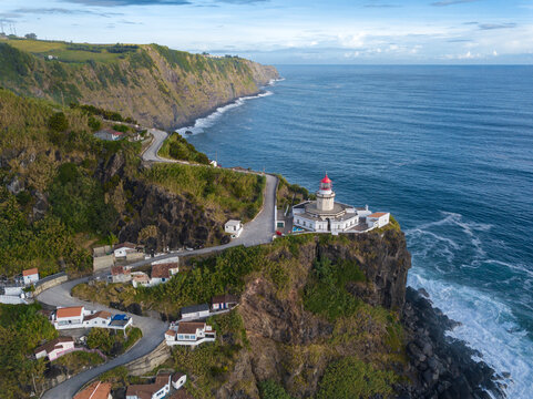 Aerial view of Farol do Arnel lighthouse and fishermen huts, Sao Miguel island, Azores, Portugal, Atlantic